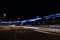 Light trails of fire truck trough the city